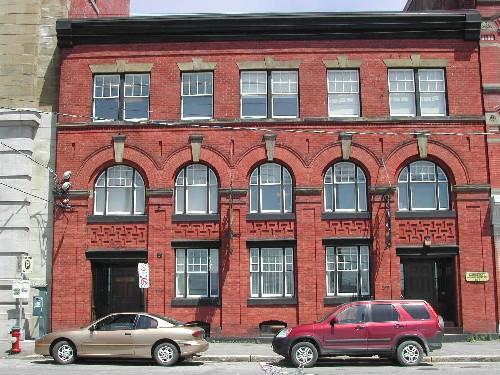 This photograph shows the contextual view of the building, 2005; City of Saint John