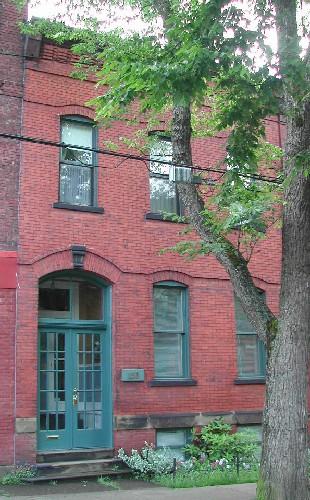 This photograph shows a contextual view of the building on Germain Street, 2005.; City of Saint John
