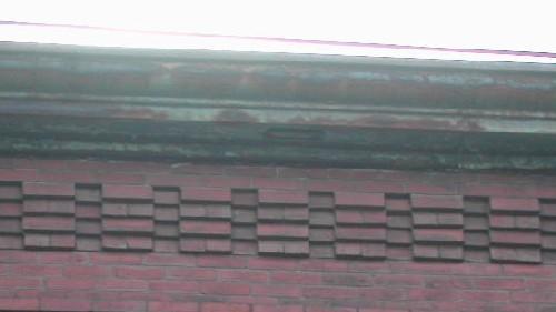 This image provides a view of the cornice ornamented with brick corbel bands, 2005; City of Saint John