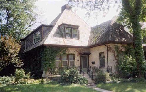 A distinctive hipped roof and prominent dormers highlight this French Cottage style home.; City of Windsor Planning Department