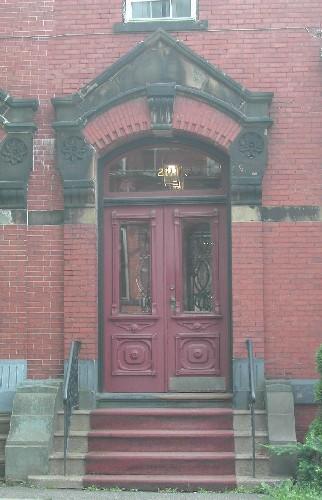 This image provides a view of the entrance and of the elaborate pedimented entablature, 2005.  ; City of Saint John