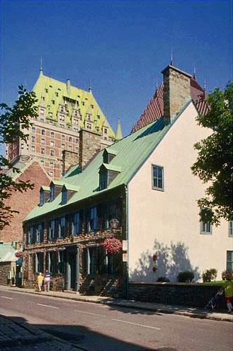 Side view of Maillou House showing its asymetrical façade and 19th-century features including a Venetian window and exterior iron shutters.; Parks Canada Agency / Agence Parcs Canada.