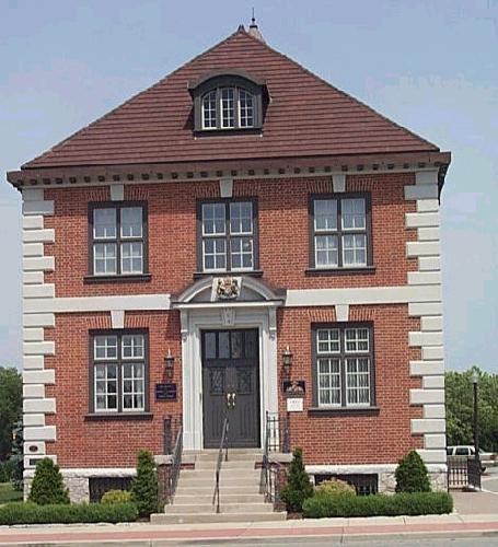 Concrete quoins and belt courses accentuate the red brick in this Albert Kahn-designed building.; City of Windsor, Nancy Morand