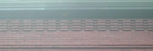 This image provides a view of the cornice ornamented with brick corbel bands, 2005.; City of Saint John