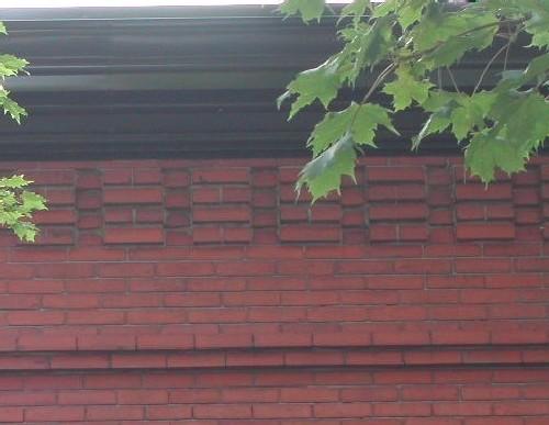This image provides a view of the cornice ornamented by brick corbel bands, 2005.; City of Saint John