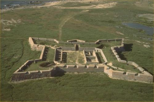 Aerial view showing the footprint and profile of remnants of the unique star-shaped fort and of the battery at Cape Merry; Parks Canada Agency / Agence Parcs Canada
