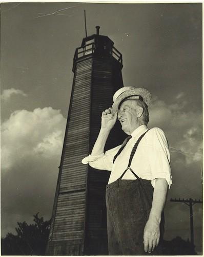 John Sutherland standing in front of the Port Burwell Lighthouse; Port Burwell Marine Museum, Museums of Bayham