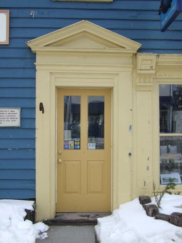 This photograph shows the entrance with pediment and illustrates one of the pilasters that flanks the storefront window, 2007

; Town of St. Andrews
