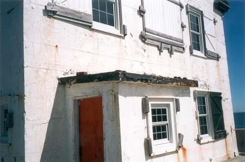 Detail view of the structure’s simple two-and-a-half-storey form, massing and proportions, the gable roof, and returned eaves, 1999.; Canadian Coast Guard / Garde côtière canadienne, 1999.