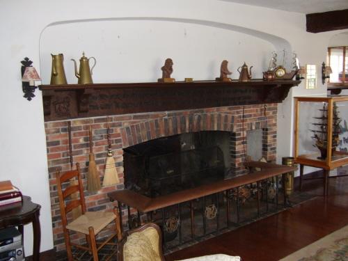 This photograph shows the fireplace and the 2.5 metre mantle with hand carved poetry, 2007; Town of St. Andrews