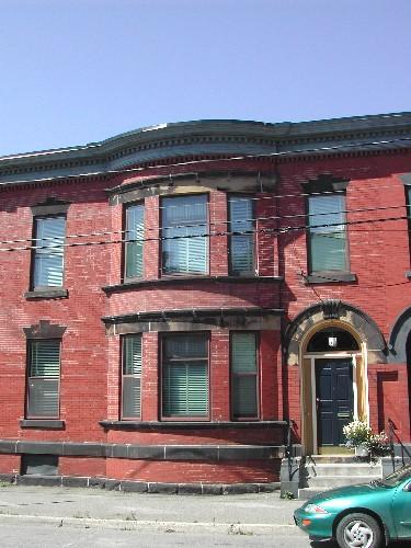 This photograph shows the full front façade view of this building, 2005; City of Saint John