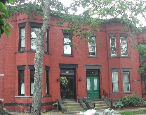 This photograph shows a contextual view of the building on Germain Street, 2005.; City of Saint John