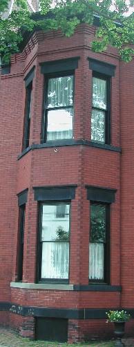 This image provides a view of the two-storey, semi-octagonal bay windows, 2005.; City of Saint John