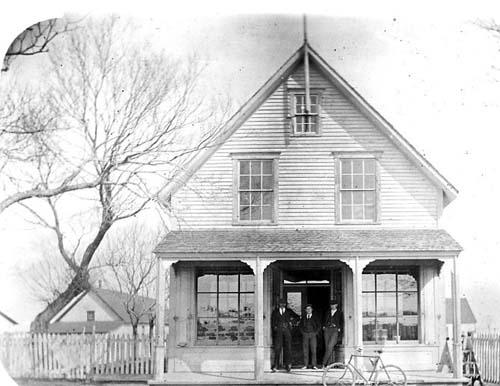 This building was built by Fruing Co. as a general store. Photo taken circa 1910.; Fidèle Thériault Collection