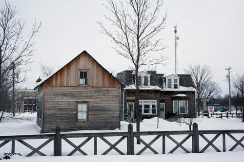 Contextual view, from the northwest, of the McDougall House (with another designated City of Winnipeg site, Pembina Highway House, in the background), Winnipeg, 2007; Historic Resources Branch, Manitoba Culture, Heritage and Tourism, 2007