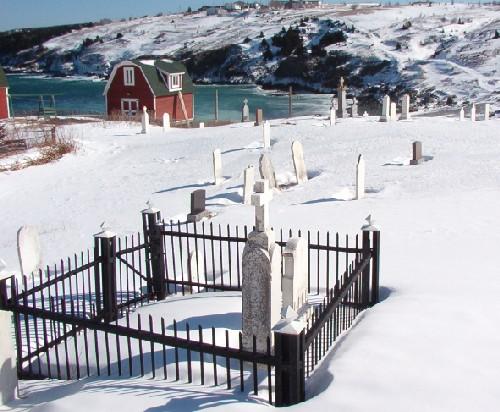 A portion of Old St. Nicholas Anglican Cemetery, Torbay, NL as seen from Lower Street, looking towards Torbay Beach, 2006/02/23.; Lara Maynard, HFNL, 2006.