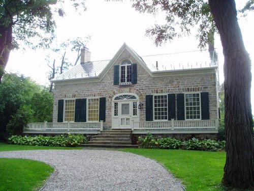 View of the front of house including Black Locust trees; OHT