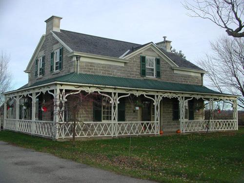View of the façade and north side showing the reconstructed Regency verandah - 2001; OHT - 2001