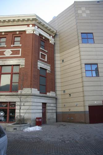 Contextual view, from the north, of the Odd Fellows Temple Facade (left) and an adjoining new shopping complex (right), Winnipeg, 2006; Historic Resources Branch, Manitoba Culture, Heritage and Tourism, 2006