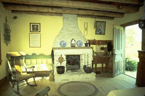 Interior view of the kitchen showing the fireplace at the west end of the house – August 2005; OHT, 2005