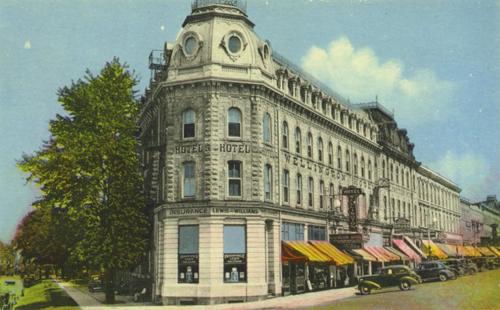 Historic view of the building showing signage, fire escapes, and iron cresting – c. 1930; Guelph Public Library, 2005