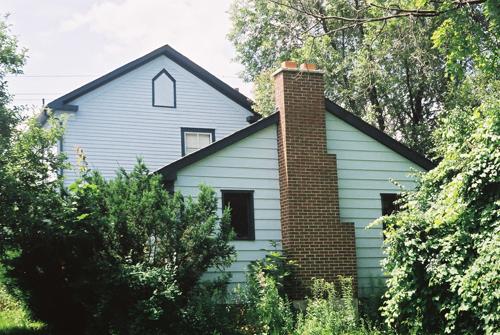 View of the east elevation showing the one-storey wing at the building's rear – July 2004; OHT, 2004