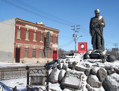 Contextual view, from the southwest, of the Belgian Club (and in the foreground another designated City of Winnipeg Site, the Belgian War Memorial), Winnipeg, 2006; Historic Resources Branch, Manitoba Culture, Heritage, Tourism and Sport, 2007