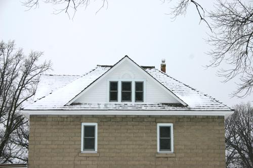 Detail view of the concrete block walls and roof of the Presbyterian Church Manse, Emerson, 2006; Historic Resources Branch, Manitoba Culture, Heritage, Tourism and Sport, 2006