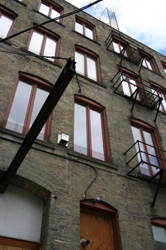 Rear elevation, from the east (showing the hoisting mechanism), of the Miller and Richard Type Foundry Building, Winnipeg, 2006; Historic Resources Branch, Manitoba Culture, Heritage, Tourism and Sport, 2006