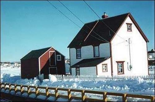 Rear view of Adam Mouland House, Bonavista, showing its linhay and the fish store on the property, circa winter of 1998.; HFNL 1998