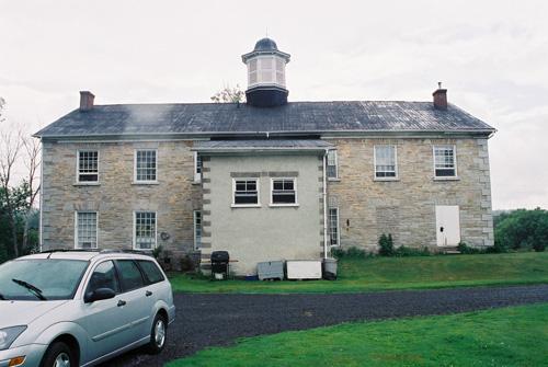 View of the north elevation showing concrete block addition at the rear – July 2004; OHT, 2004