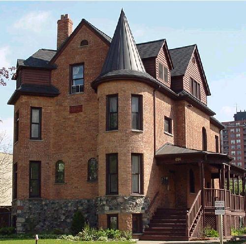 A colossal stone foundation and conical-roofed tower contribute to the castle-like appearance.; City of Windsor, Planning Department, 2002