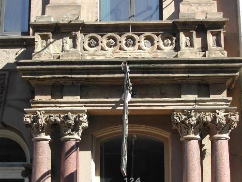 This photograph shows the large entablature over the entrance and illustrates carved flora and fauna in the capitals, 2005; City of Saint John