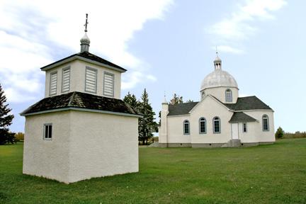 Contextual view, from the southeast, of the New St. Elias Ukrainian Orthodox Church and Bell Tower, Sundown area, 2007; Historic Resources Branch, Manitoba Culture, Heritage, Tourism and Sport, 2007