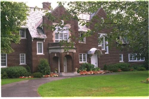 This Queen Anne Revival "house on the hill" was built 1911, and rebuilt after fire in 1944; City of Ottawa 2005