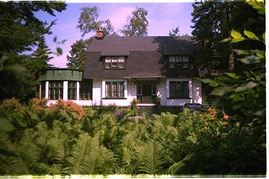 A charming, Victorian-style house of white stucco dates from about 1909.; City of Ottawa 2005