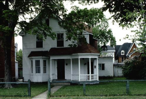 Set well back from the street, the house features picturesque vergeboard with gingerbread details; City of Ottawa 2005