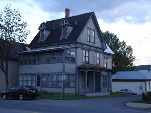 Image of 702 Main showing the exterior woodwork.; Carleton County Historical Society