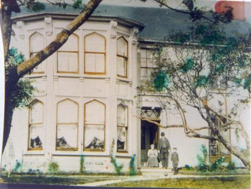 View of Ridley Hall as it looked historically as a dwelling. The people at the front door may be the Ridley family.  Photo taken circa 1895.; HFNL 2007