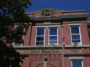 View of sandstone details, including inscriptions and coat of arms.; Carleton County Historical Society