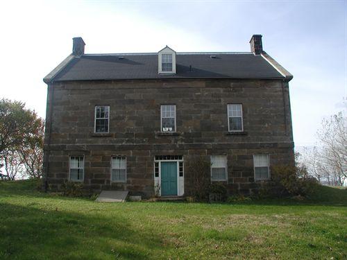 Rear elevation, Peter Smyth House, Port Hood, NS, 2002. This entrance would have originally be used by servants, leading to their quarters.; Inverness County Heritage Advisory Committee, 2002