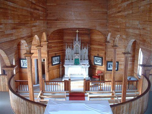 Traditional gothic altar and stations of the cross, Saint Joseph's Roman Catholic Church, Marble Mountain, Nova Scotia, December 2007.; Heritage Division, Nova Scotia Department of Tourism, Culture and Heritage, December 2007