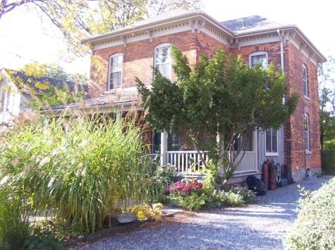 Italianate style with Tuscan front porch and wide eaves with scrolled brackets and dentil trim.; City of Thorold