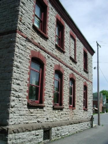 The western view of the Mississippi Valley Textile Mill, showcasing its sandstone exterior – 2003; OHT, 2003