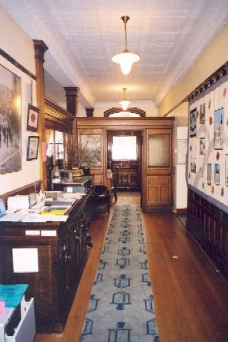 View of the interior of the office space showing the patterned tin ceiling – 2003; OHT, 2003