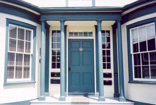 View of main entrance showing Doric columns, wooden door, sidelights and transom – July 2003; OHT, 2003