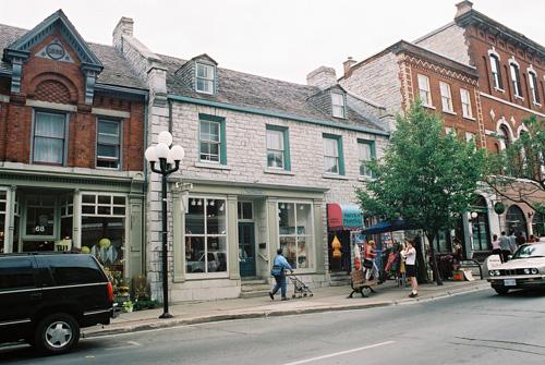 View of façade at 70-72 Princess Street showing proportions and limestone composition – July 2004; OHT, 2004