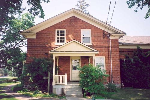 View of the north elevation of the main house showing the secondary entrance – August 2003; OHT, 2003