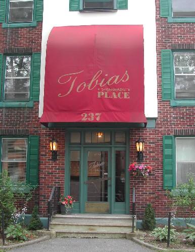 This image provides a view of the entry with side lights and rectangular, multi-paned transom window, 2005.; City of Saint John