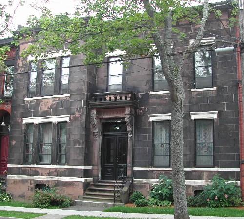 This photograph shows a contextual view of the building on Germain Street, 2005.; City of Saint John